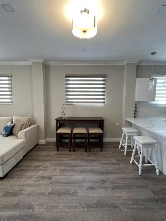 a living room with a couch and a table at SHAK Condos- Luxury, Functionality and Comfort in Saint Helena