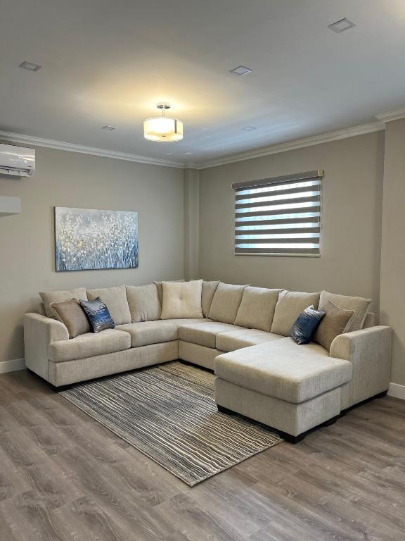 a living room with a couch and a rug at SHAK Condos- Luxury, Functionality and Comfort in Saint Helena
