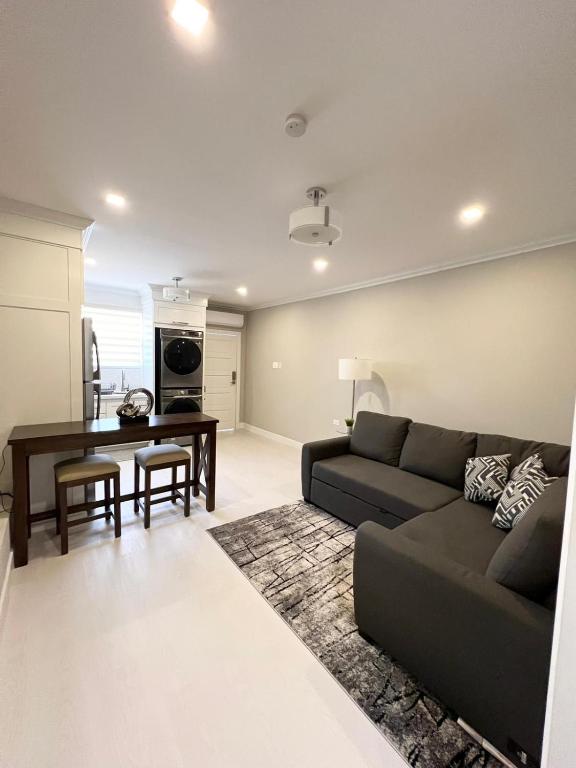 a living room with a couch and a table at SHAK Condos- Luxury, Functionality and Comfort in Saint Helena