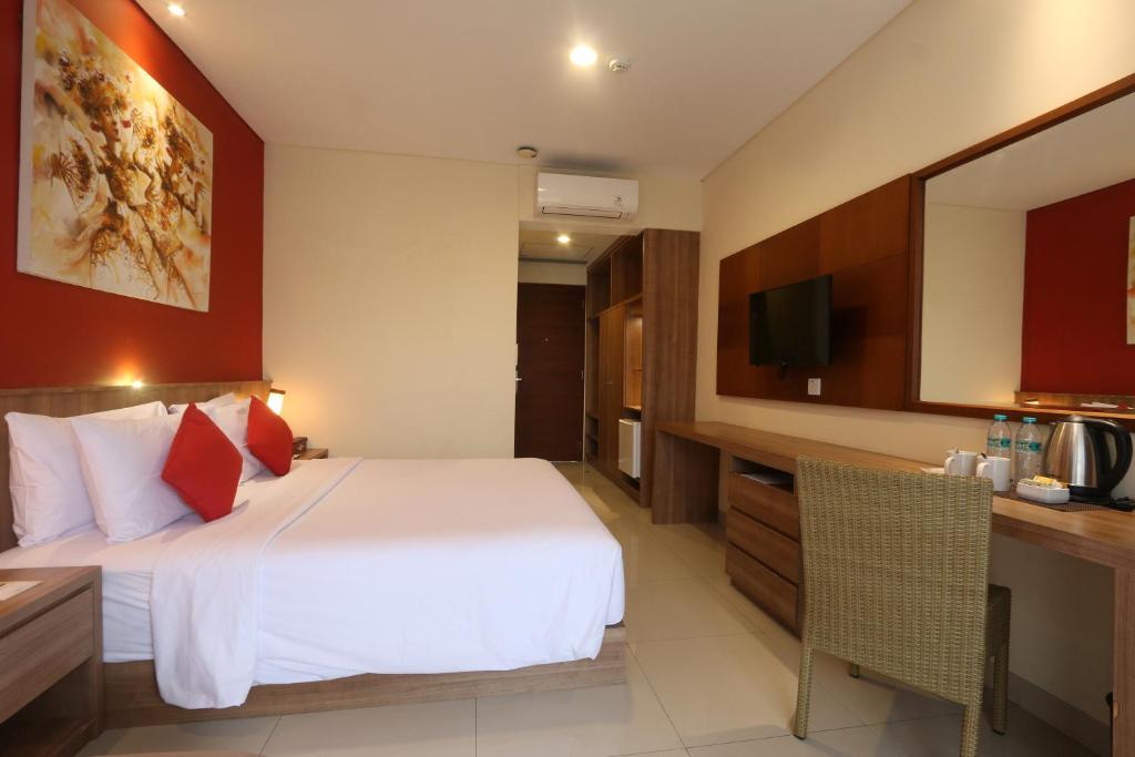 Postel nebo postele na pokoji v ubytování Grand La Walon Hotel