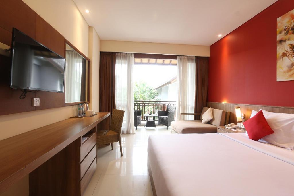 Postel nebo postele na pokoji v ubytování Grand La Walon Hotel