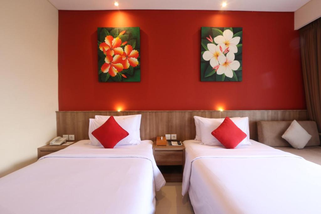 Postel nebo postele na pokoji v ubytování Grand La Walon Hotel