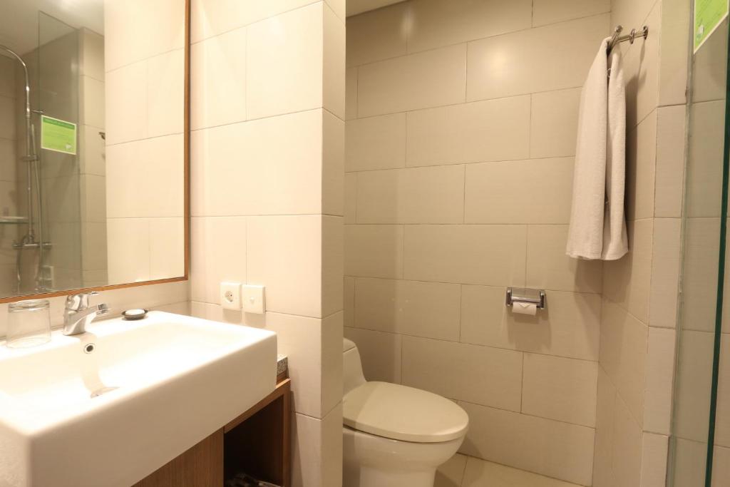 Koupelna v ubytování Grand La Walon Hotel