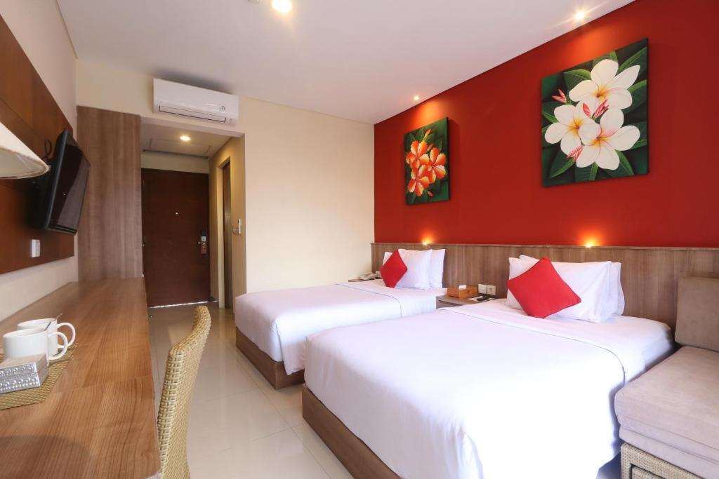 Postel nebo postele na pokoji v ubytování Grand La Walon Hotel
