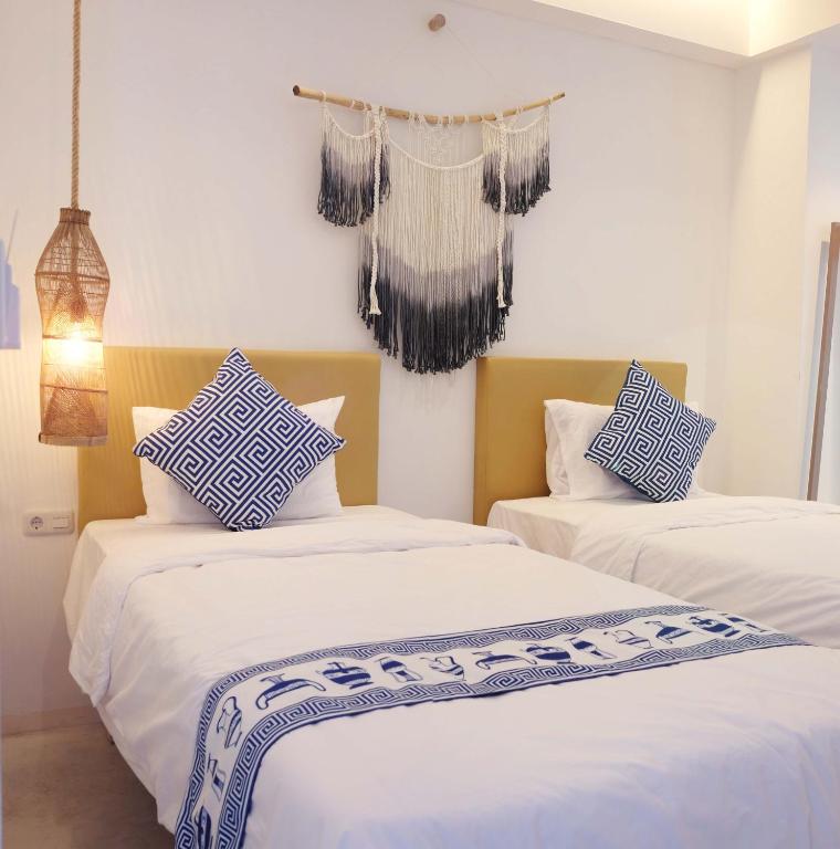 Postel nebo postele na pokoji v ubytování Little Mykonos