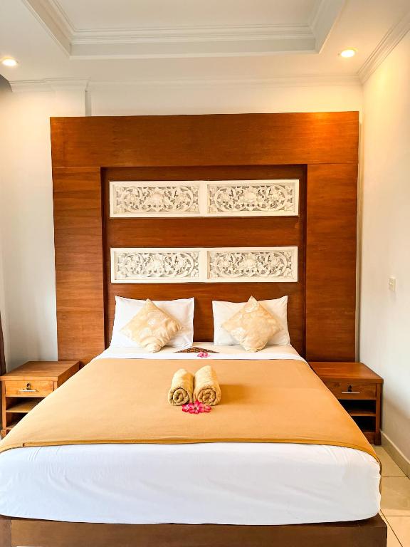 Postel nebo postele na pokoji v ubytování The Donno ubud Guest house