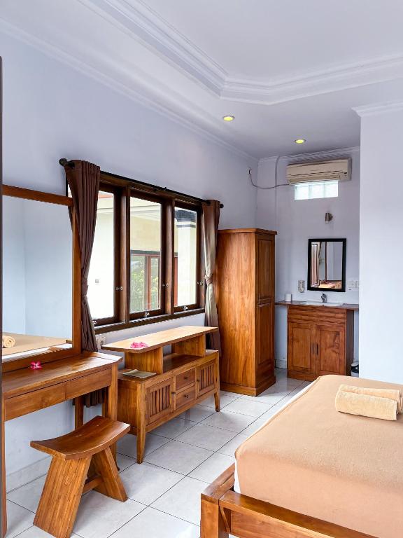 Postel nebo postele na pokoji v ubytování The Donno ubud Guest house