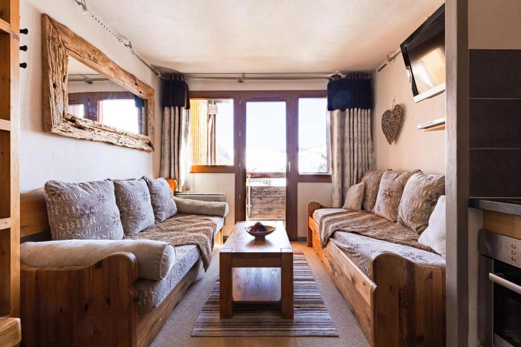 a living room with two couches and a coffee table at Central modern Duplex for 6 by Avoriaz Chalets in Avoriaz