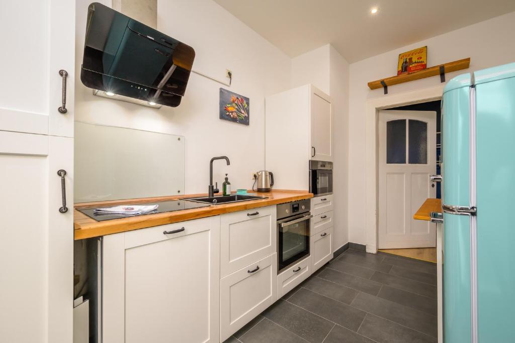 Kuchyň nebo kuchyňský kout v ubytování Arbio I Modern Apart near Leipzig Stötteritz