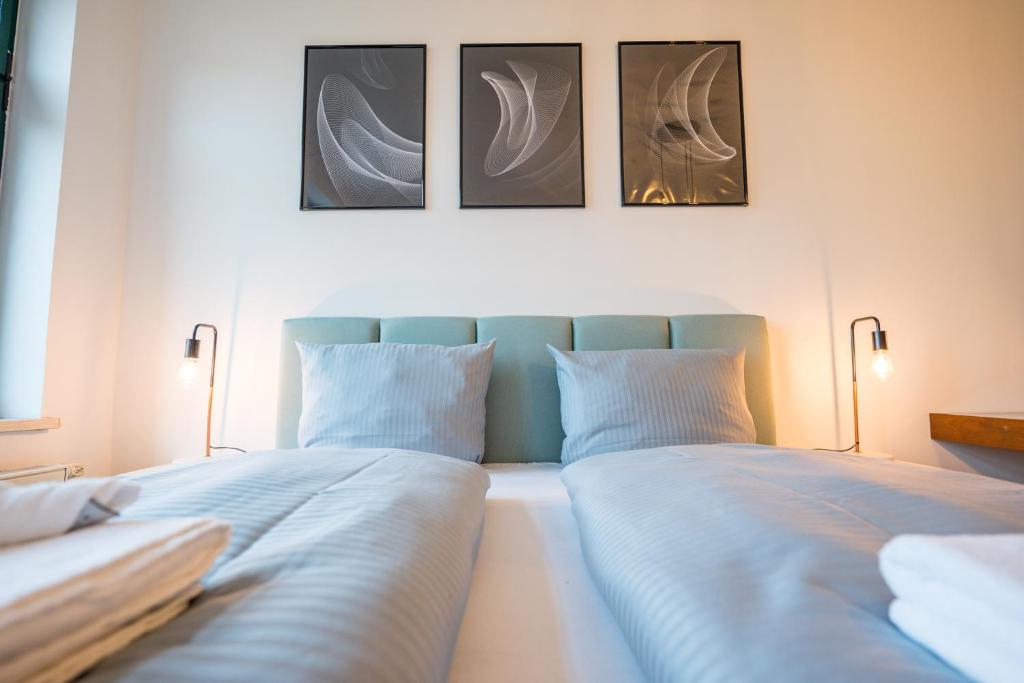 Postel nebo postele na pokoji v ubytování Arbio I Modern Apart near Leipzig Stötteritz