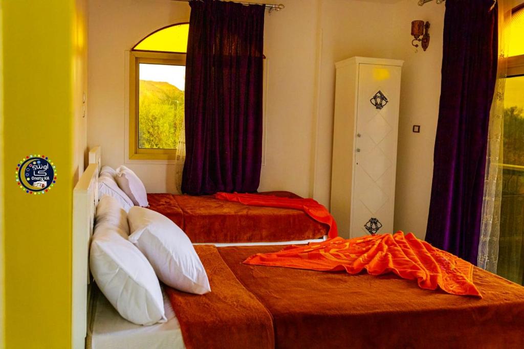 Postel nebo postele na pokoji v ubytování Onaty Ka Guest House