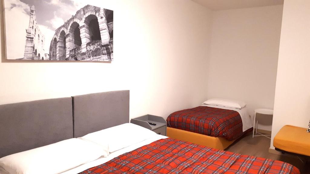 Postel nebo postele na pokoji v ubytování Sulla Ciclabile Apartment lungo il fiume Adige