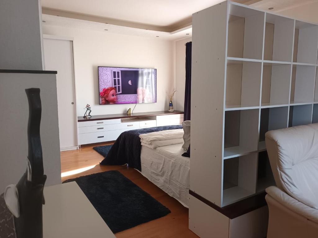 Postel nebo postele na pokoji v ubytování Skaistakalnio apartamentai