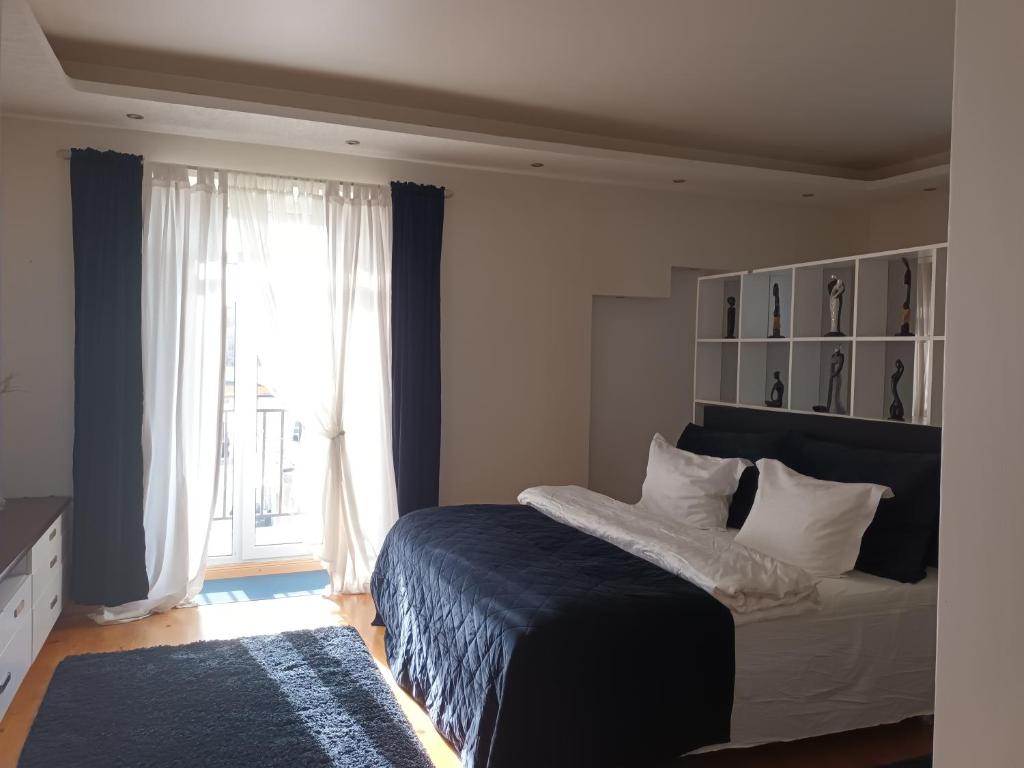 Postel nebo postele na pokoji v ubytování Skaistakalnio apartamentai