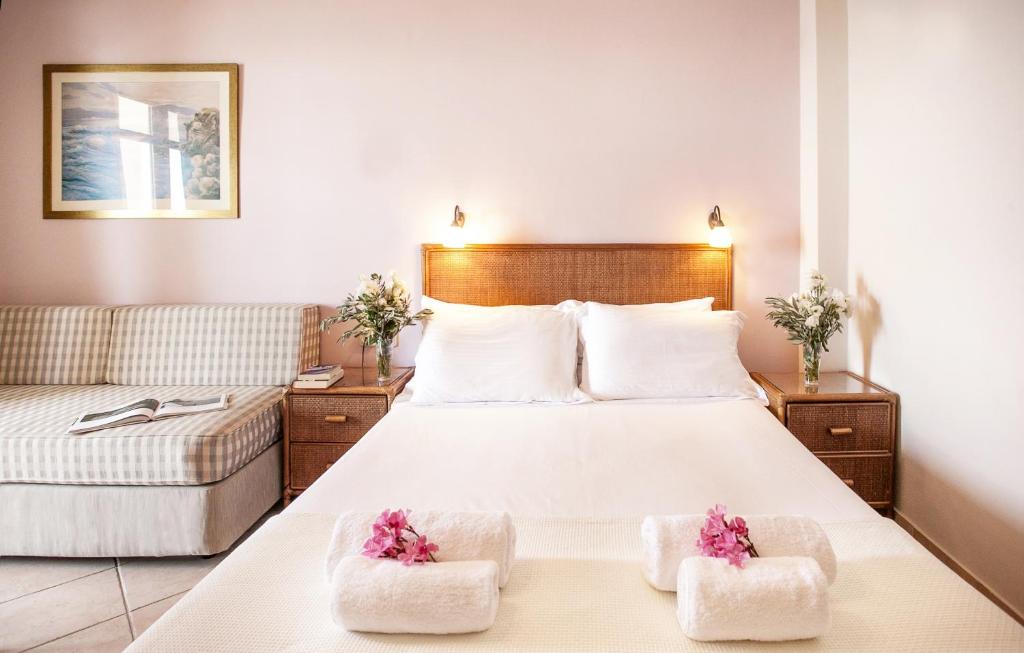 Postel nebo postele na pokoji v ubytování Hotel Paralio