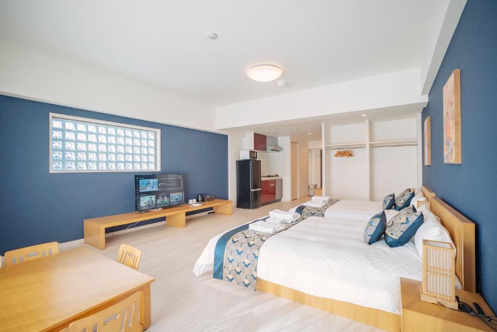 Postel nebo postele na pokoji v ubytování 谷町君 HOTEL 恵美須町72
