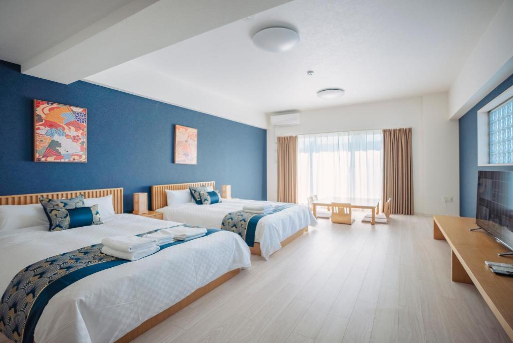 Postel nebo postele na pokoji v ubytování 谷町君 HOTEL 恵美須町72