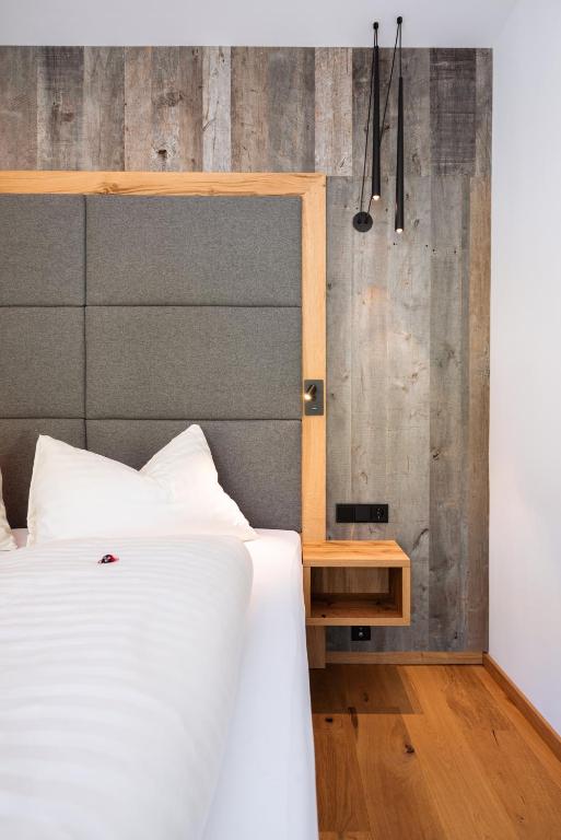 Ein Bett oder Betten in einem Zimmer der Unterkunft Hotel Lohningerhof