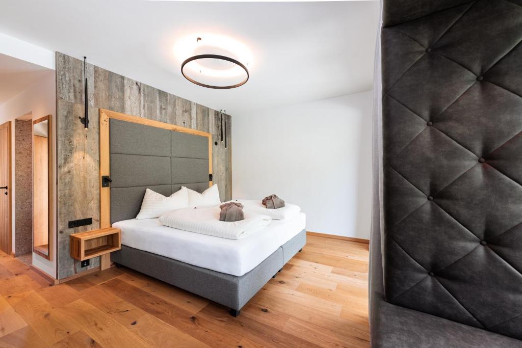 Ein Bett oder Betten in einem Zimmer der Unterkunft Hotel Lohningerhof