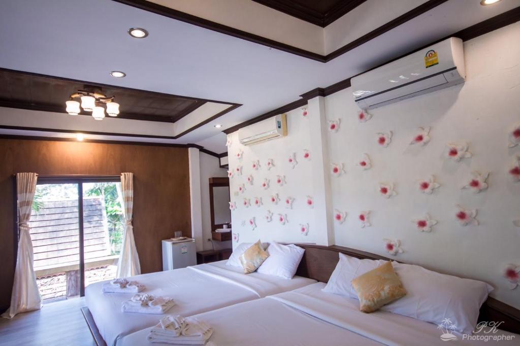 Cama o camas de una habitación en Suanya Kohkood Resort and Spa
