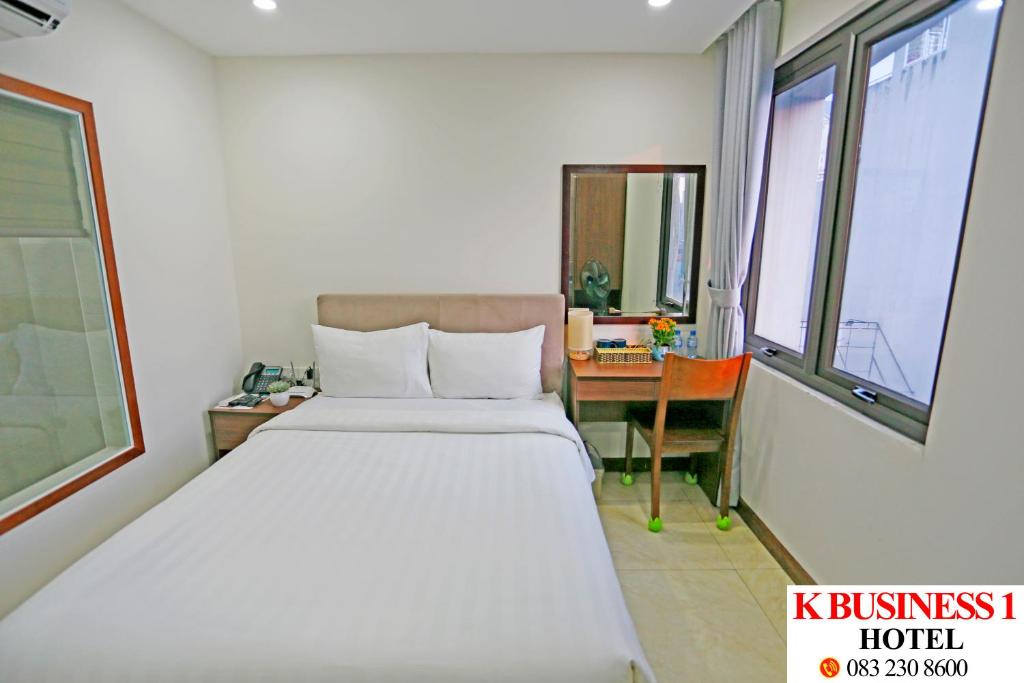 Postel nebo postele na pokoji v ubytování K Business 1 Hotel My Dinh 미딩