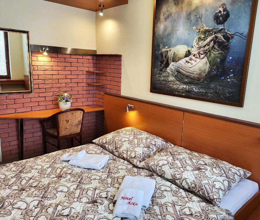 Postel nebo postele na pokoji v ubytování Hotel Áčko