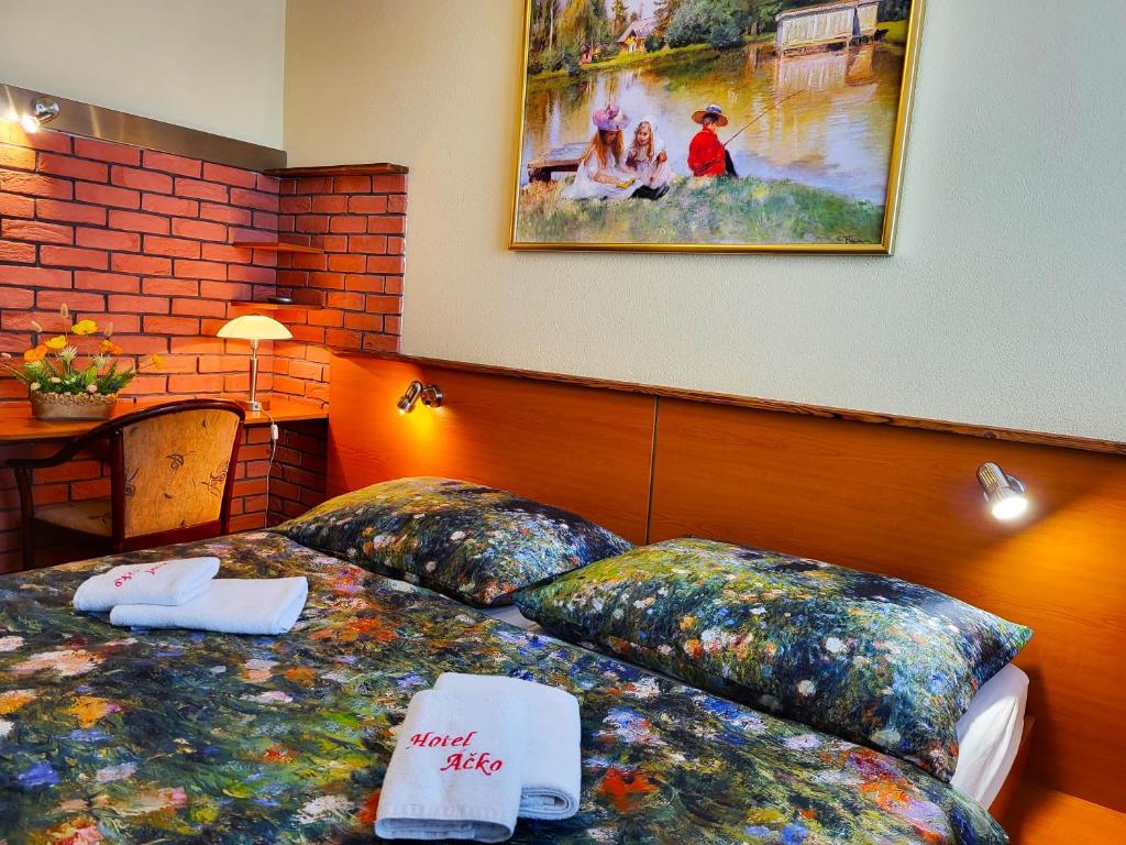 Postel nebo postele na pokoji v ubytování Hotel Áčko
