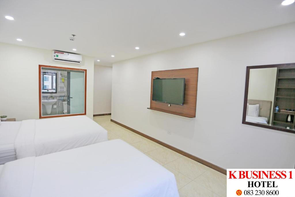 Postel nebo postele na pokoji v ubytování K Business 1 Hotel My Dinh 미딩