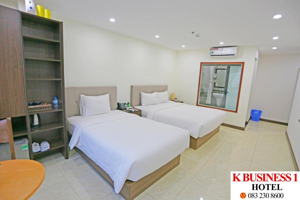 Postel nebo postele na pokoji v ubytování K Business 1 Hotel My Dinh 미딩