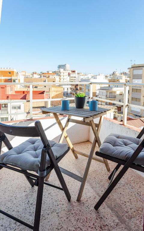 a table and two chairs on a roof at Town center Apartment El Perello Valencia in El Perelló