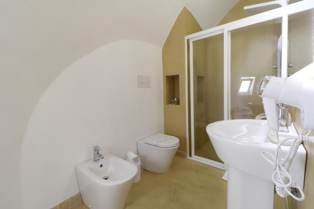 Koupelna v ubytování Hotel Capo Campolato