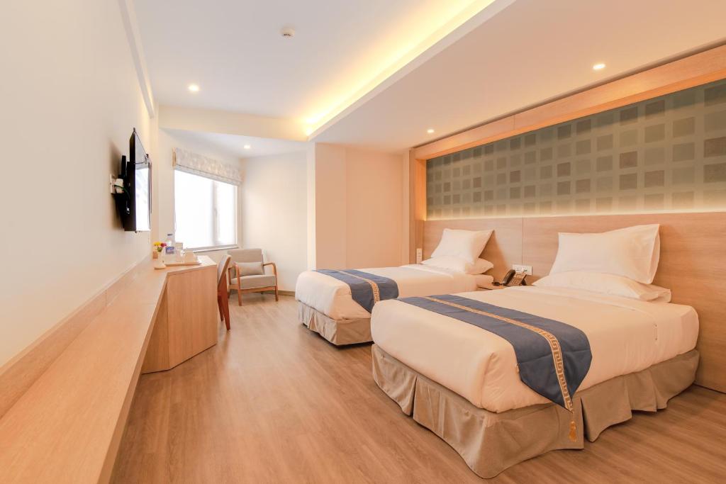 Postel nebo postele na pokoji v ubytování Mila Hotel