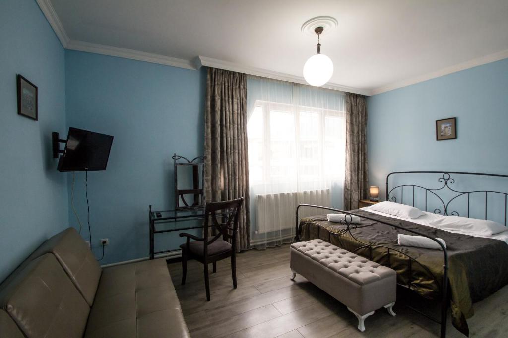 Postel nebo postele na pokoji v ubytování Hotel Svaneti