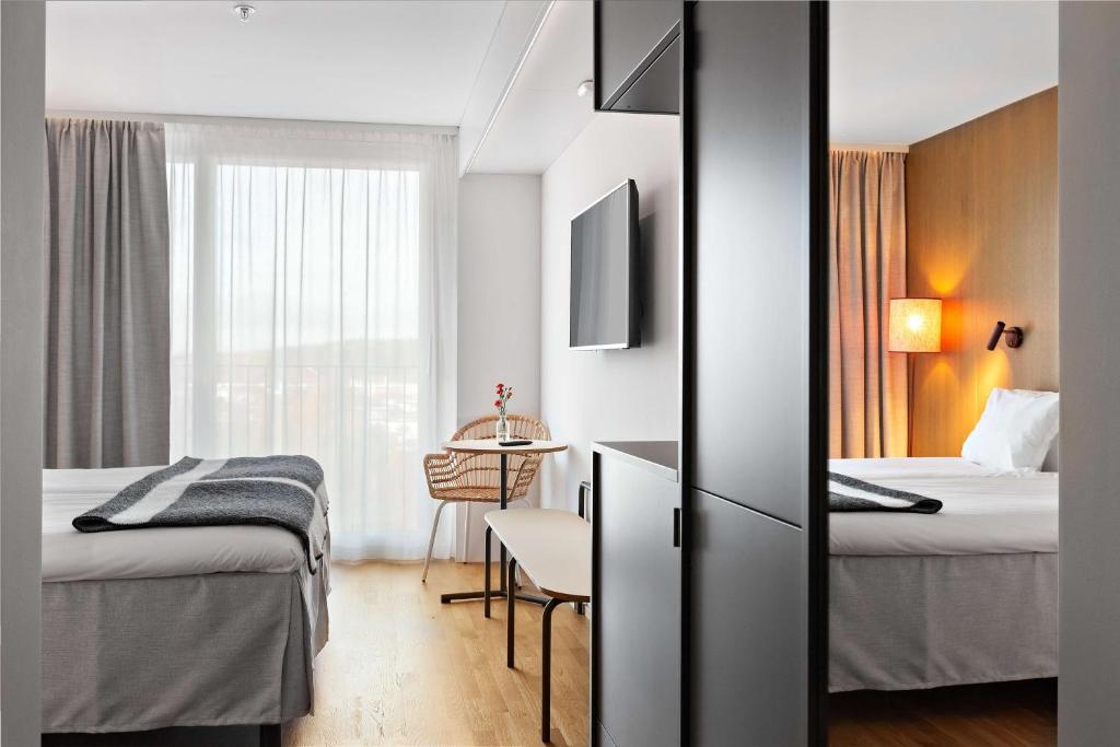 Postel nebo postele na pokoji v ubytování Best Western Plus Ten Hotel