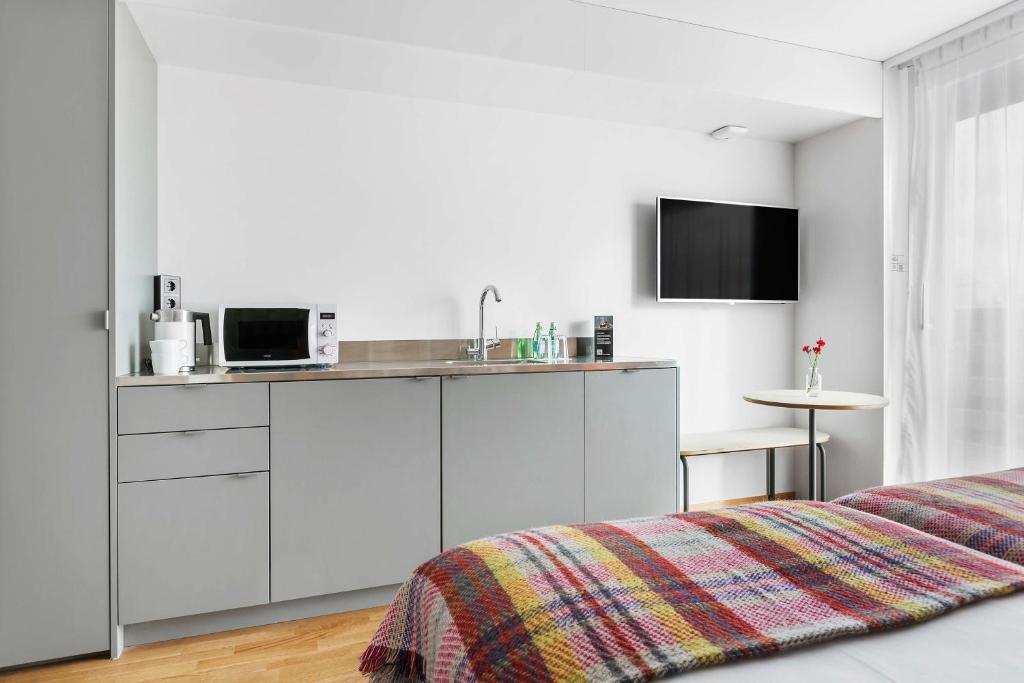 TV a/nebo společenská místnost v ubytování Best Western Plus Ten Hotel