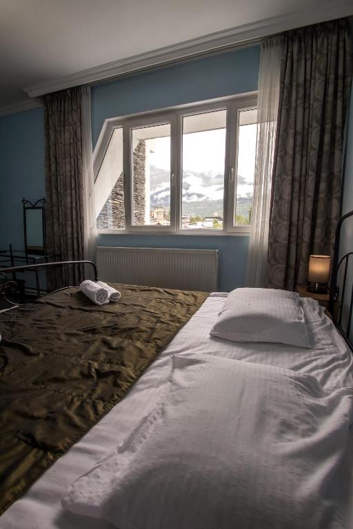 Postel nebo postele na pokoji v ubytování Hotel Svaneti