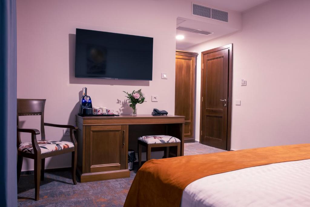 Postel nebo postele na pokoji v ubytování Hotel Aura Unirii