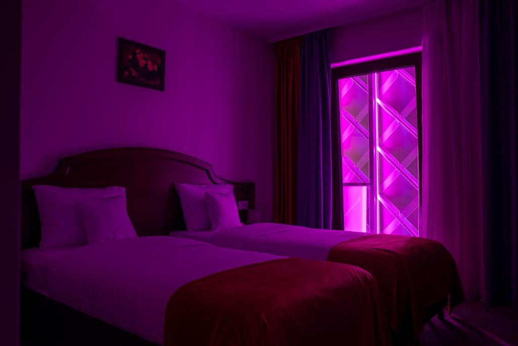 Postel nebo postele na pokoji v ubytování Hotel Aura Unirii