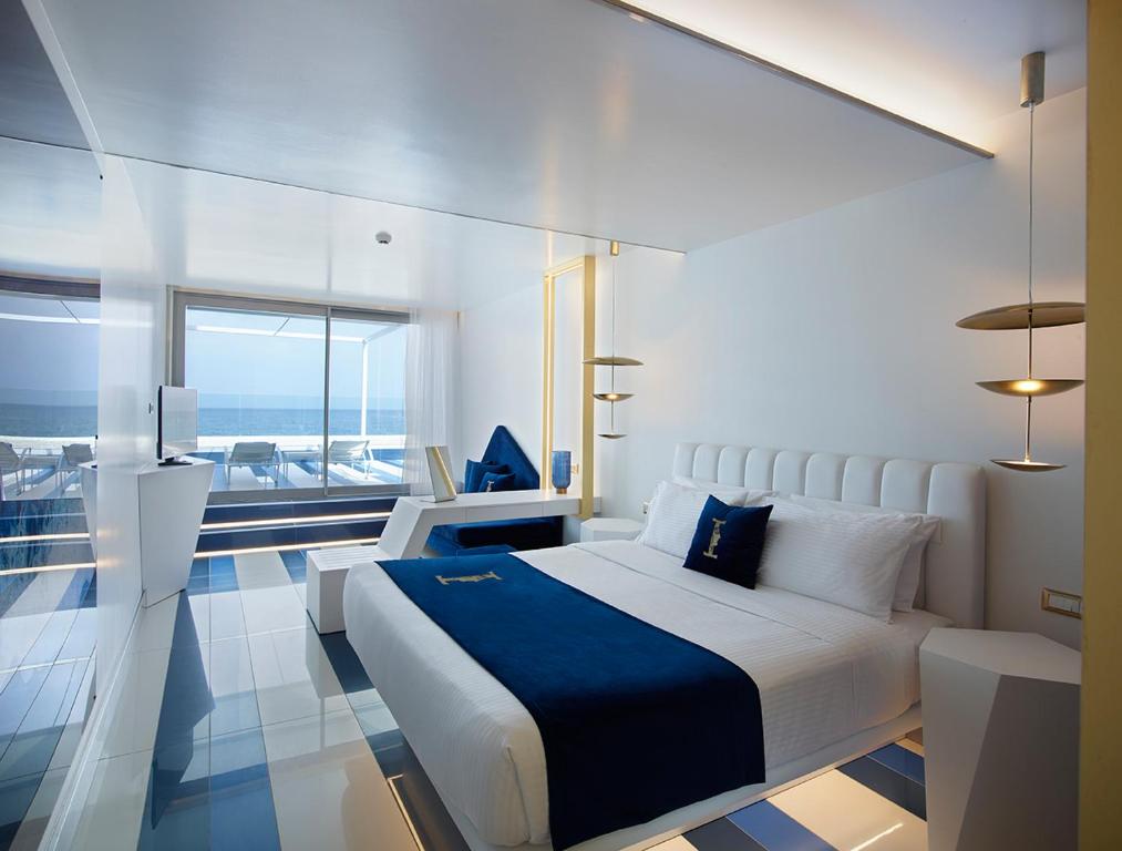 Ein Bett oder Betten in einem Zimmer der Unterkunft I Resort Beach Hotel & Spa