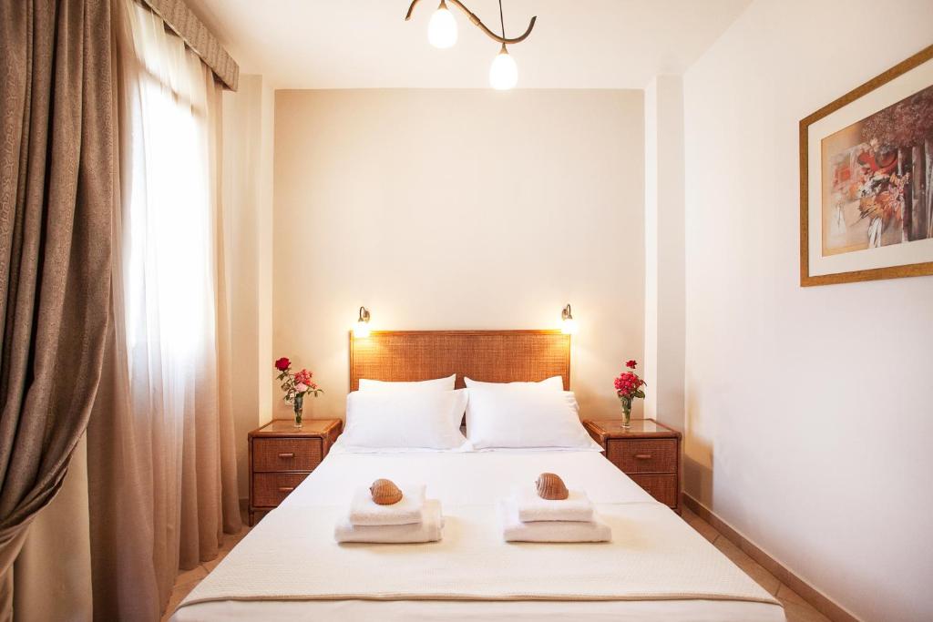 Postel nebo postele na pokoji v ubytování Hotel Paralio