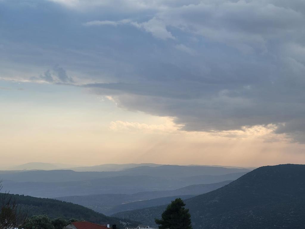a view of a valley with mountains in the distance at Home away from home in Safed