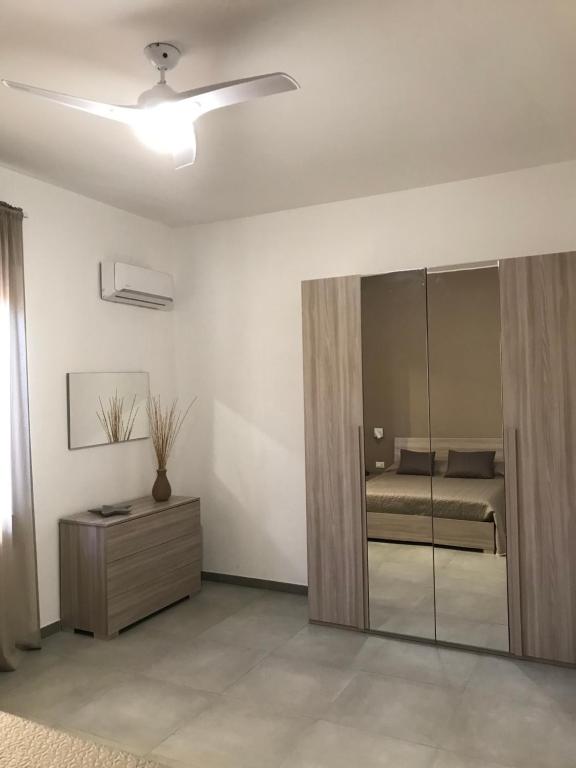 Łóżko lub łóżka w pokoju w obiekcie Scogliera apartments