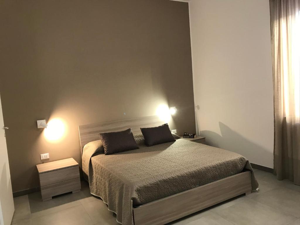 Łóżko lub łóżka w pokoju w obiekcie Scogliera apartments