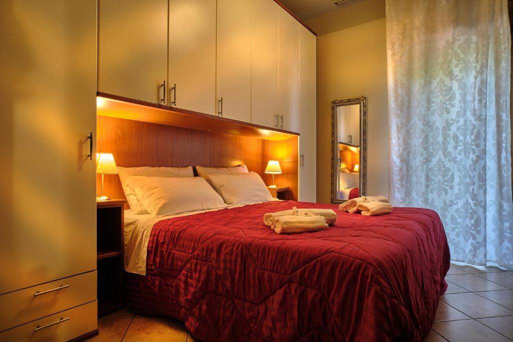 Posteľ alebo postele v izbe v ubytovaní Cozzi Apartment