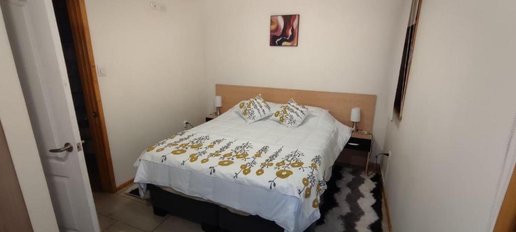 Postel nebo postele na pokoji v ubytování APART HOTEL EN BULNES