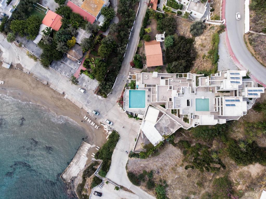 an aerial view of a villa next to the beach at Bali Diamond "by Checkin" Adults Only in Bali