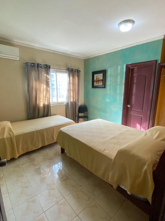 Postel nebo postele na pokoji v ubytování Canal Inn Panama