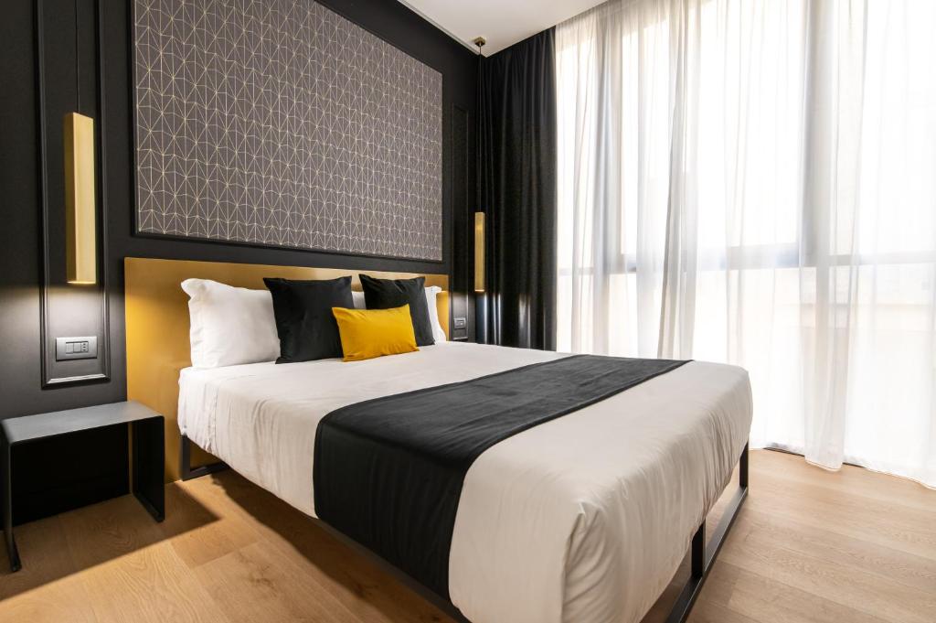 Łóżko lub łóżka w pokoju w obiekcie Plebiscito Boutique Rooms