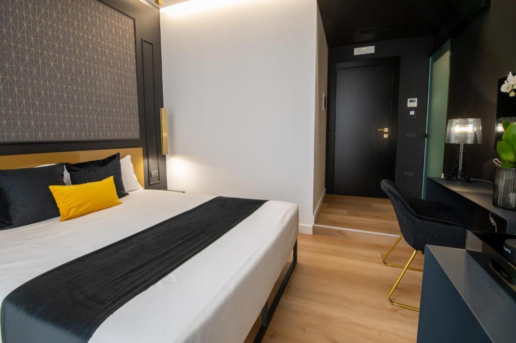 Łóżko lub łóżka w pokoju w obiekcie Plebiscito Boutique Rooms