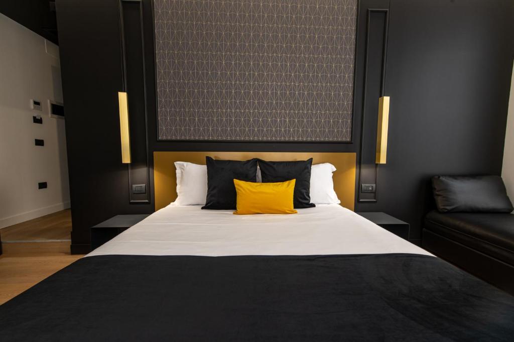 Łóżko lub łóżka w pokoju w obiekcie Plebiscito Boutique Rooms